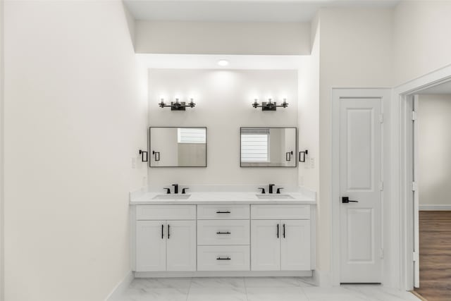 bathroom with vanity and hardwood / wood-style flooring