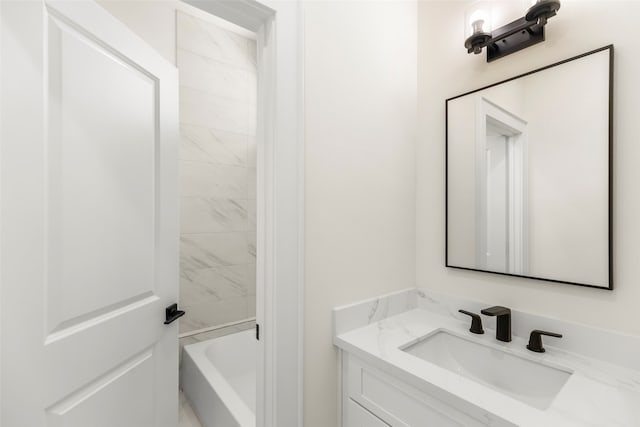 bathroom featuring a bathing tub and vanity