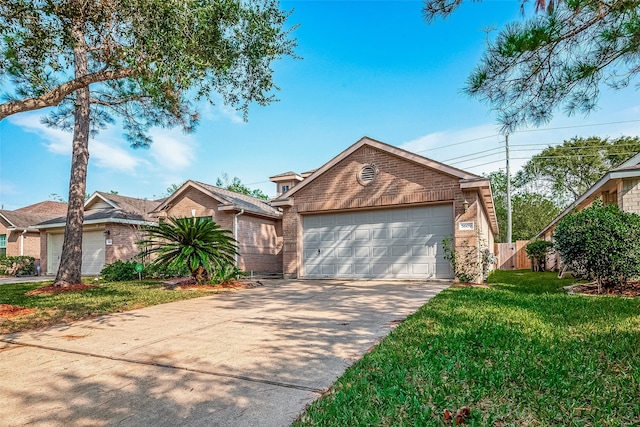 view of front of property featuring a garage and a front lawn