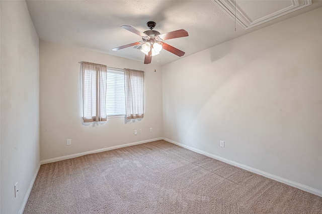 empty room with ceiling fan and carpet flooring