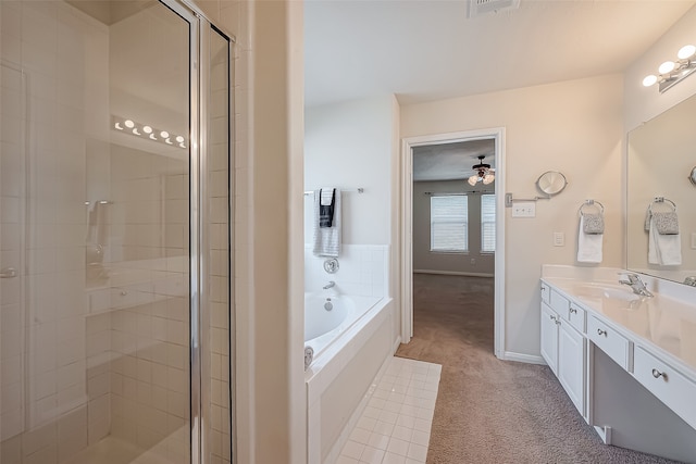 bathroom featuring independent shower and bath, ceiling fan, and vanity