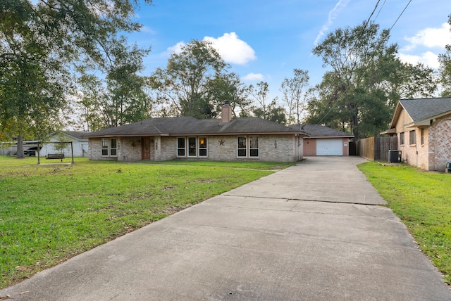 single story home with a garage, cooling unit, and a front lawn