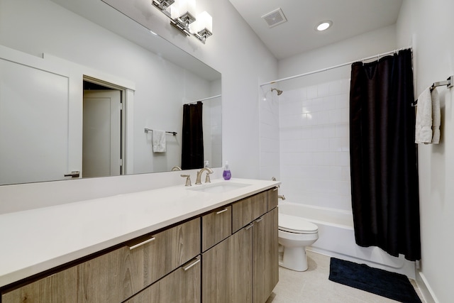 full bathroom featuring vanity, toilet, and shower / tub combo