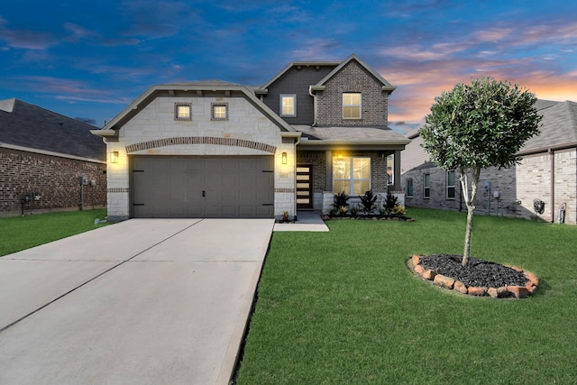 view of front of property featuring a garage and a lawn