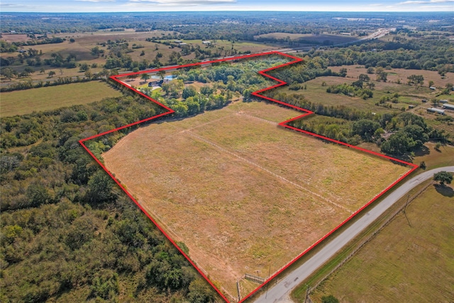 birds eye view of property featuring a rural view