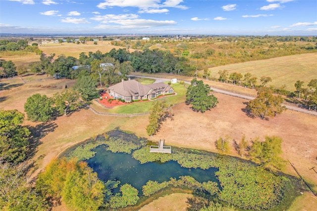 aerial view with a rural view and a water view