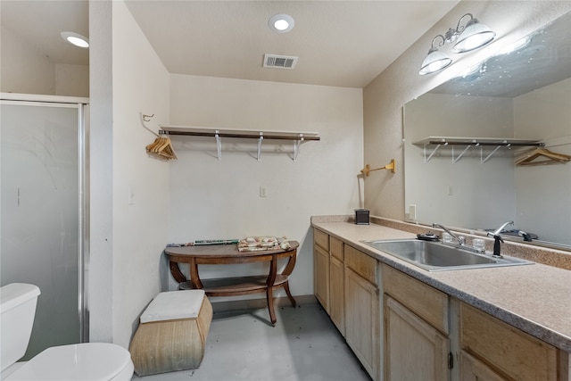 interior space featuring toilet, vanity, concrete floors, and walk in shower