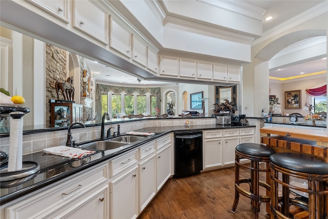 kitchen featuring crown molding, white cabinetry, black dishwasher, dark hardwood / wood-style floors, and sink