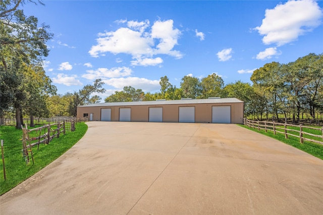 garage featuring a rural view