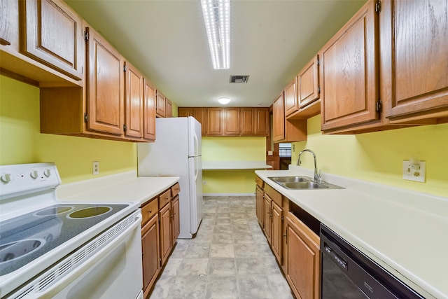 kitchen with white appliances and sink