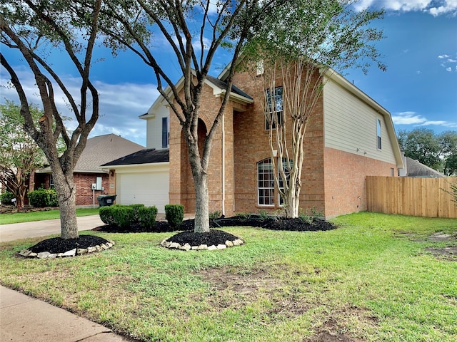 view of front of home featuring a garage and a front yard