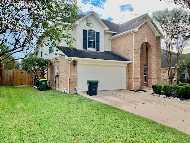 view of front of house featuring a front lawn and a garage