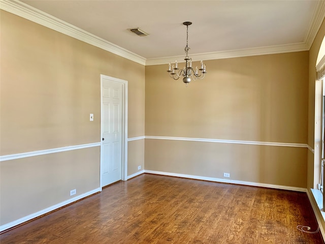 unfurnished room featuring ornamental molding, wood-type flooring, and a chandelier