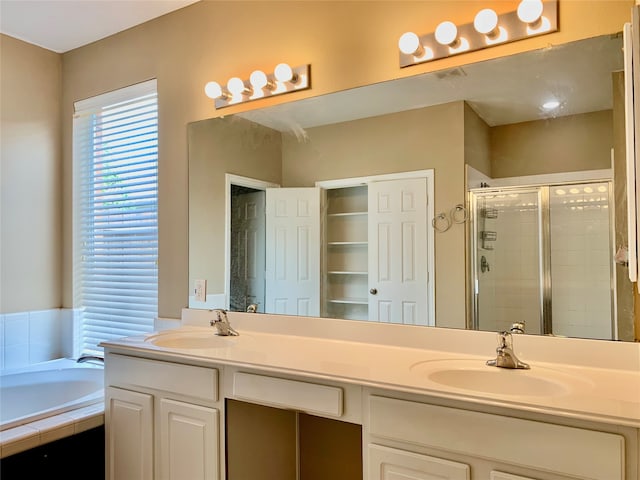 bathroom featuring vanity and plus walk in shower