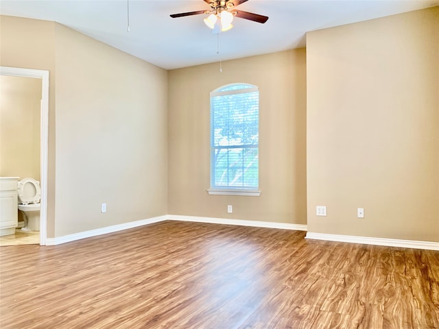 spare room with light hardwood / wood-style floors and ceiling fan