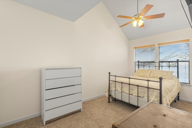 carpeted bedroom featuring high vaulted ceiling and ceiling fan