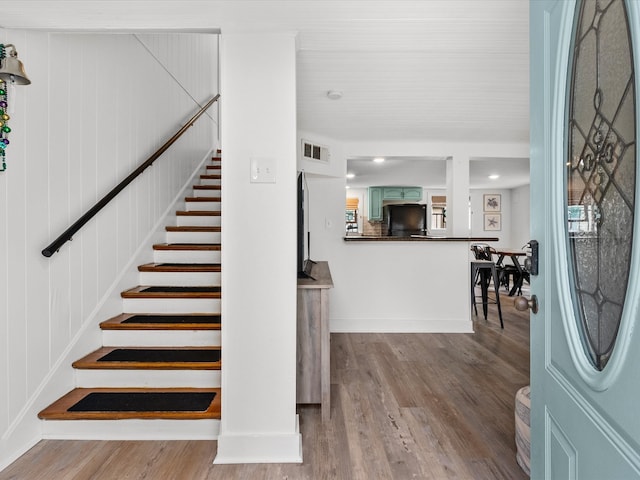 stairway featuring hardwood / wood-style flooring