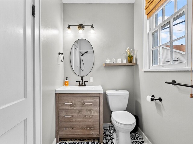 bathroom with tile patterned floors, toilet, and vanity