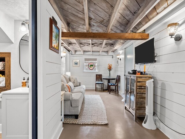 living room featuring wood walls