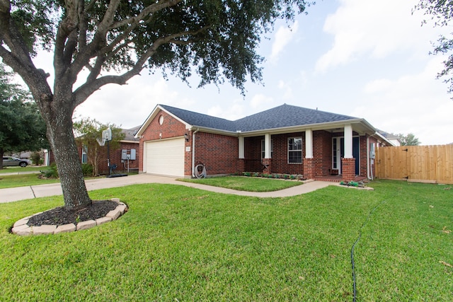 view of front of house featuring a garage and a front yard