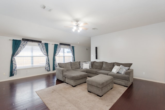 living room featuring ceiling fan and wood-type flooring