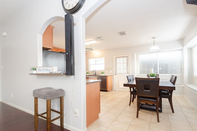 tiled dining area with sink