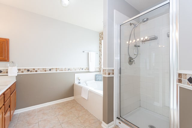 bathroom featuring vanity, tile patterned floors, and shower with separate bathtub