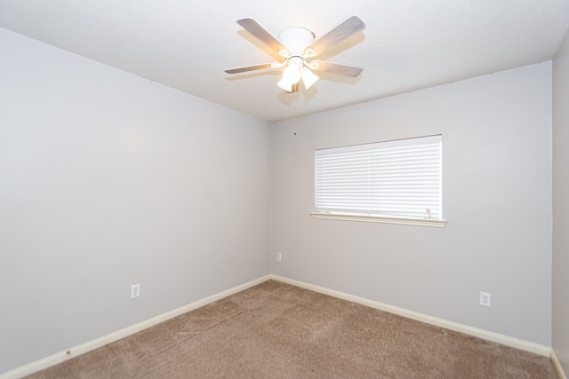 unfurnished room featuring carpet floors and ceiling fan