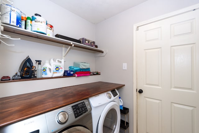 clothes washing area featuring washing machine and dryer