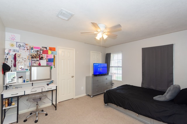 bedroom with light carpet and ceiling fan