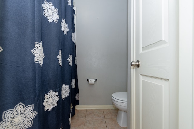 bathroom with tile patterned flooring and toilet