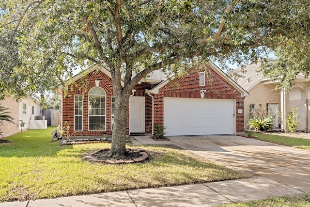 view of property featuring a garage and a front yard