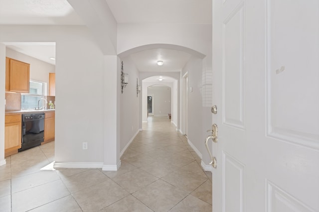 hallway with light tile patterned floors