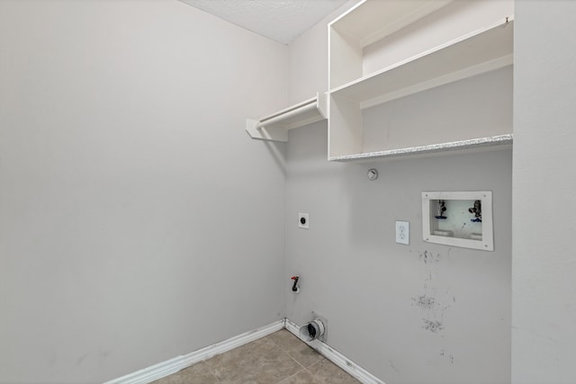 clothes washing area with gas dryer hookup, electric dryer hookup, and washer hookup