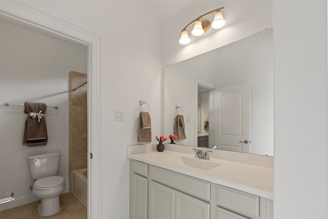 full bathroom featuring tile patterned flooring, vanity, toilet, and tiled shower / bath