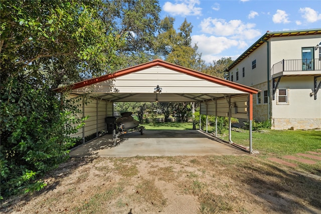 view of parking with a carport and a yard