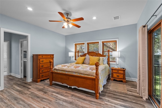 bedroom with ceiling fan and dark hardwood / wood-style floors