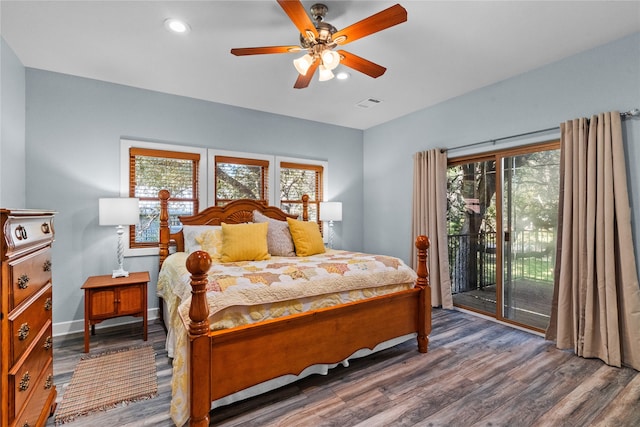 bedroom featuring ceiling fan, dark hardwood / wood-style flooring, and access to outside