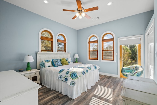 bedroom with ceiling fan and dark hardwood / wood-style floors