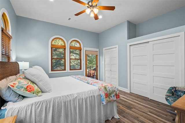 bedroom with ceiling fan and dark hardwood / wood-style floors