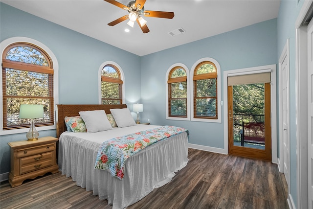 bedroom with ceiling fan, dark hardwood / wood-style floors, access to exterior, and lofted ceiling