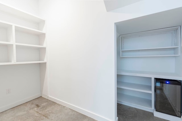 walk in closet featuring beverage cooler