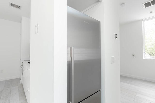 bathroom with vanity and hardwood / wood-style flooring