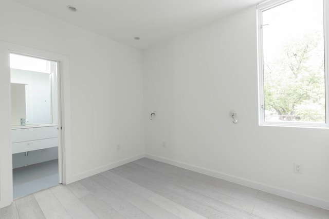 interior space with light hardwood / wood-style floors and sink