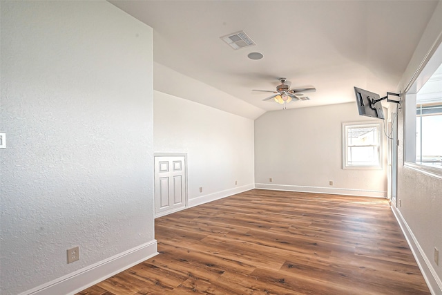 spare room featuring ceiling fan, lofted ceiling, and dark hardwood / wood-style floors