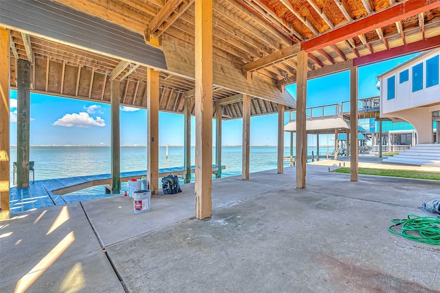 view of patio with a water view