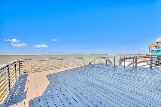 wooden deck featuring a water view