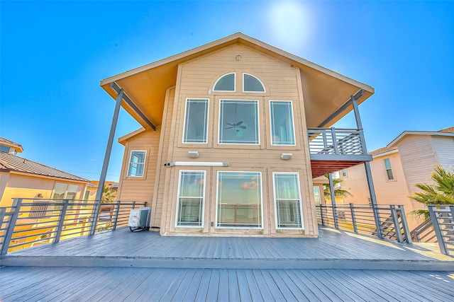 back of house featuring a deck