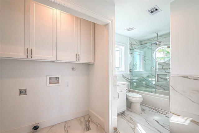 laundry area featuring cabinets, washer hookup, hookup for a gas dryer, and electric dryer hookup