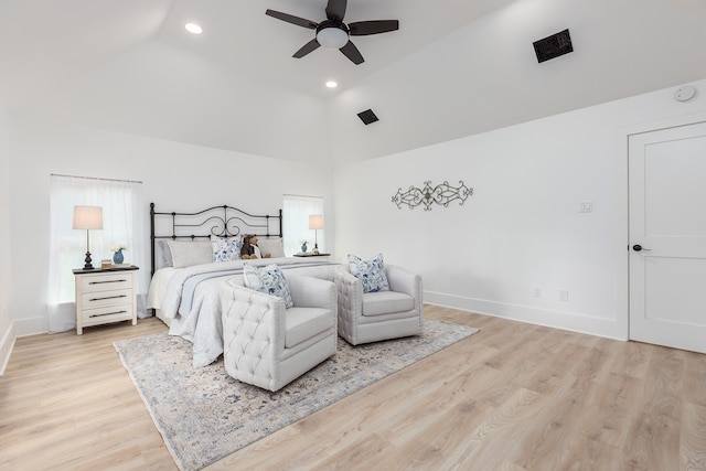 bedroom with high vaulted ceiling, ceiling fan, and light hardwood / wood-style flooring